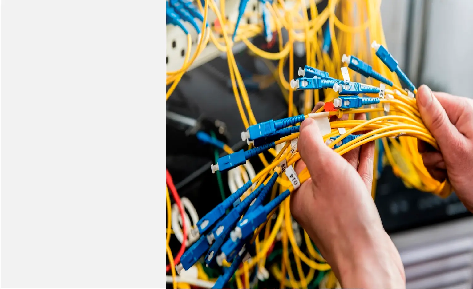 Technician connecting fiber optic cables