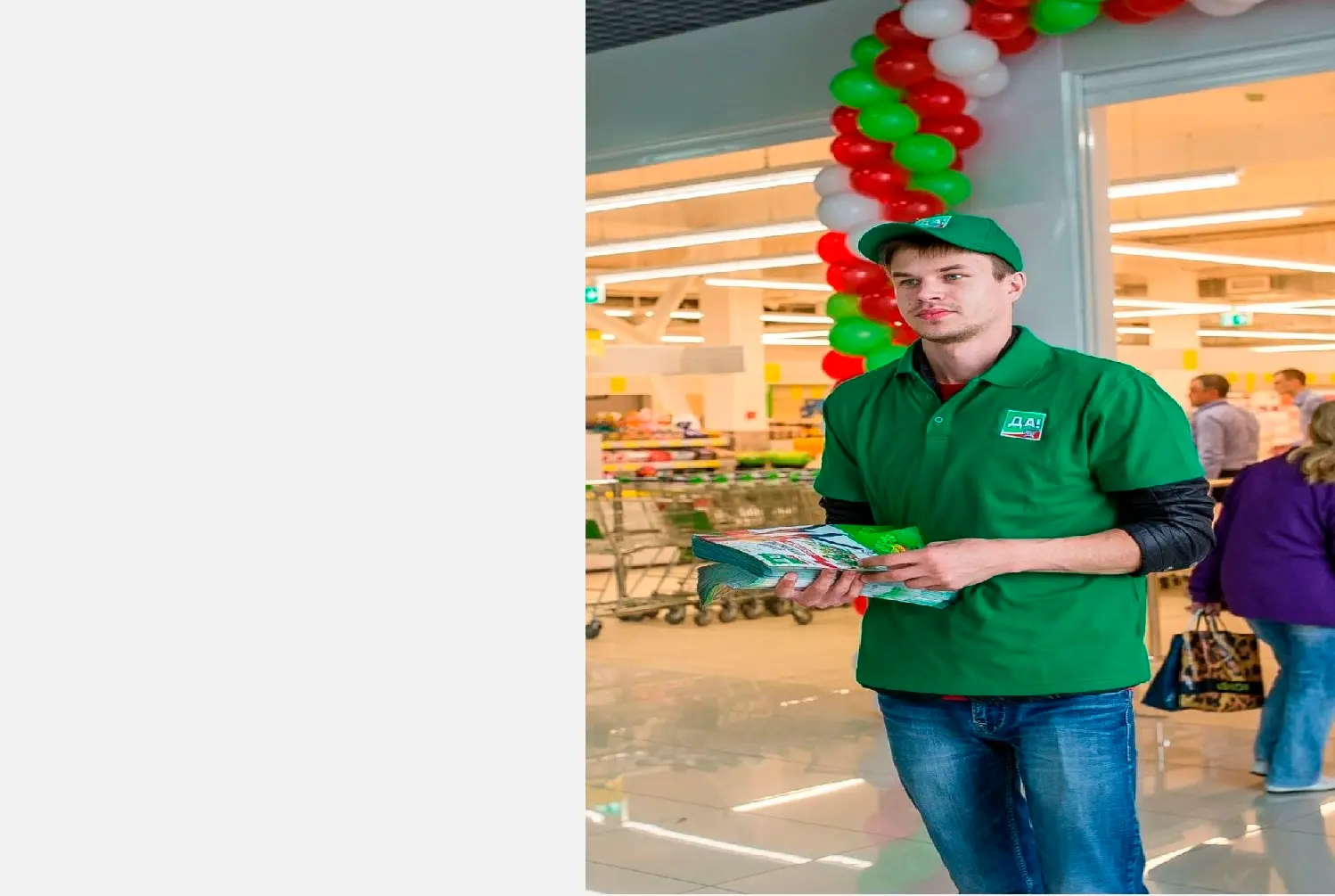 Sales representative in a green uniform in a store